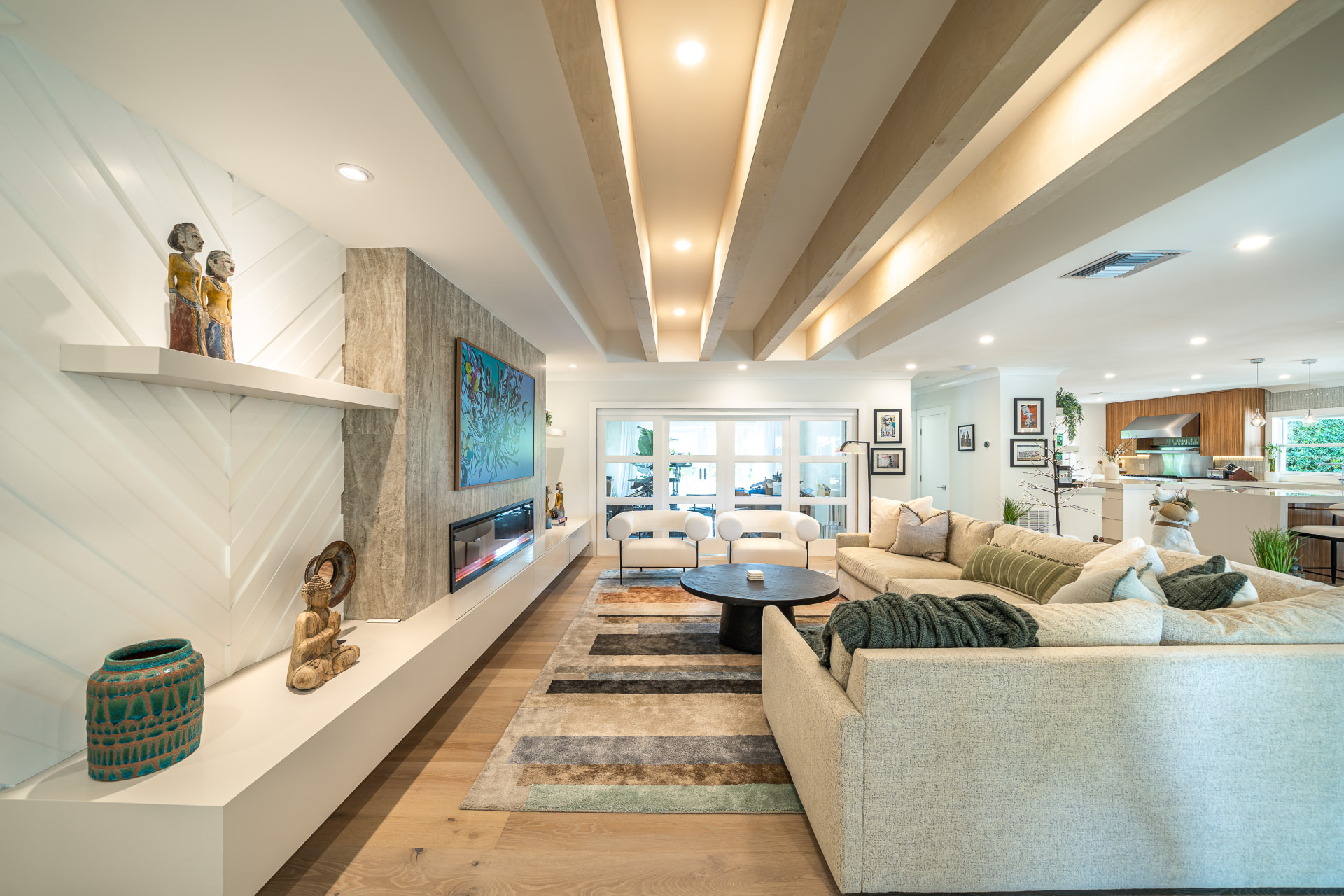 Sunlit contemporary living space with custom millwork and stone surfaces