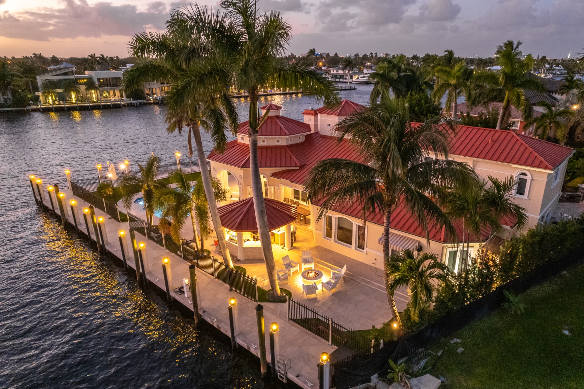Bayfront terrace outdoor living area at dusk